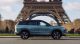 Jaecoo SUV driving in Paris near the Eiffel Tower