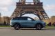 Jaecoo SUV driving in Paris near the Eiffel Tower
