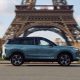 Jaecoo SUV driving in Paris near the Eiffel Tower