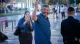 Ofer Winter smiling and waving on a city street