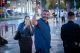 Ofer Winter smiling and waving on a city street